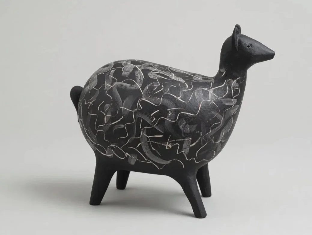 Oversized ceramic deer with a loose, contemporary white sgraffito pattern incised across the body.